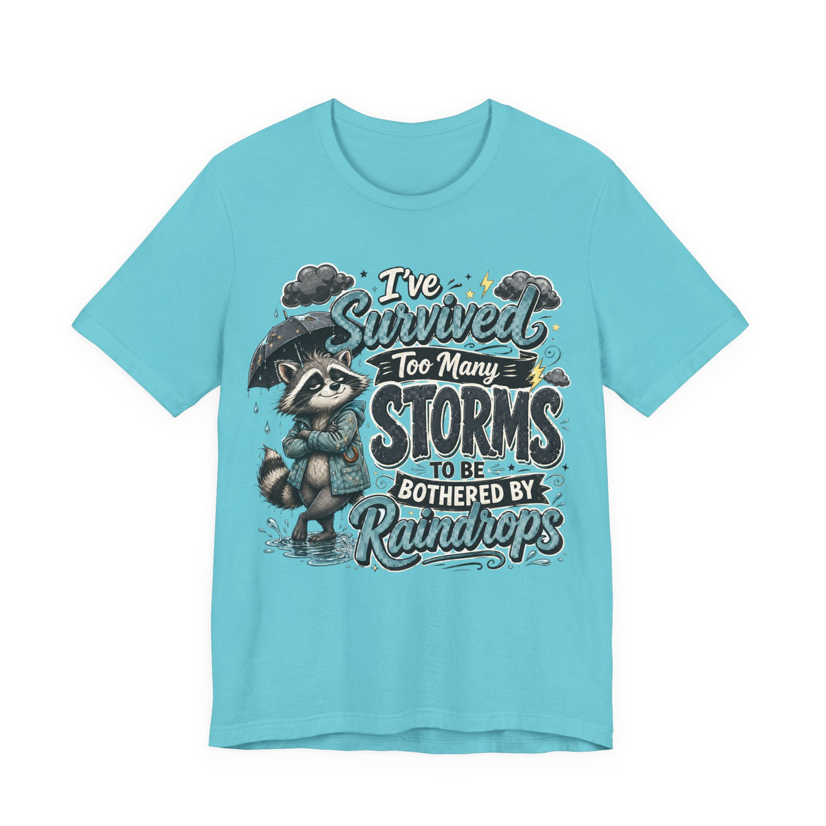 Survived Too Many Storms Tee — Inspirational Raccoon Rainy Day Graphic T-Shirt