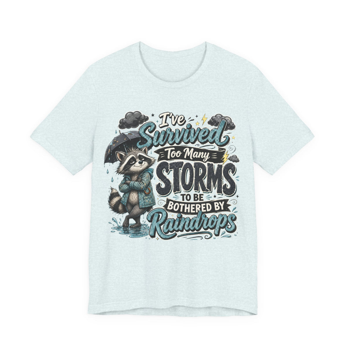 Survived Too Many Storms Tee — Inspirational Raccoon Rainy Day Graphic T-Shirt