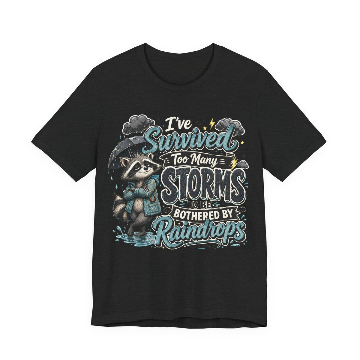 Survived Too Many Storms Tee — Inspirational Raccoon Rainy Day Graphic T-Shirt
