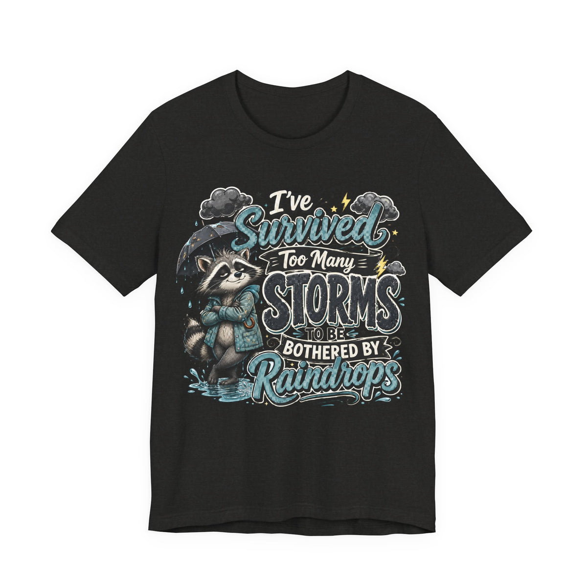 Survived Too Many Storms Tee — Inspirational Raccoon Rainy Day Graphic T-Shirt