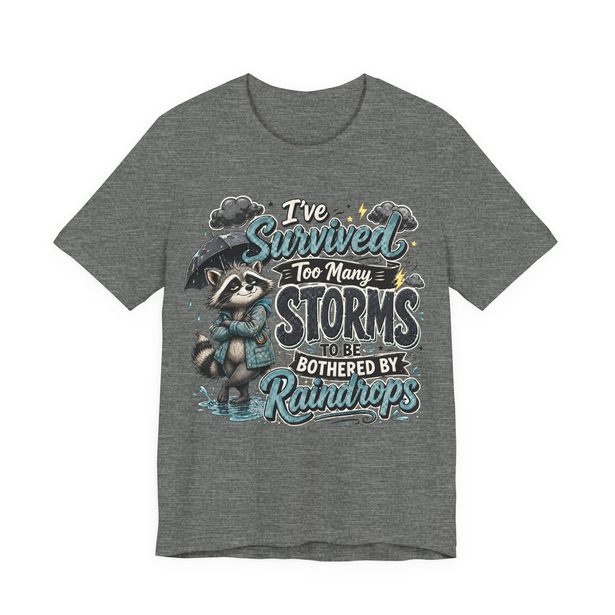 Survived Too Many Storms Tee — Inspirational Raccoon Rainy Day Graphic T-Shirt