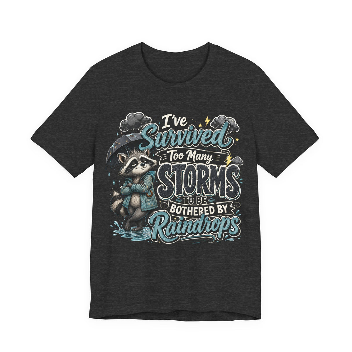 Survived Too Many Storms Tee — Inspirational Raccoon Rainy Day Graphic T-Shirt