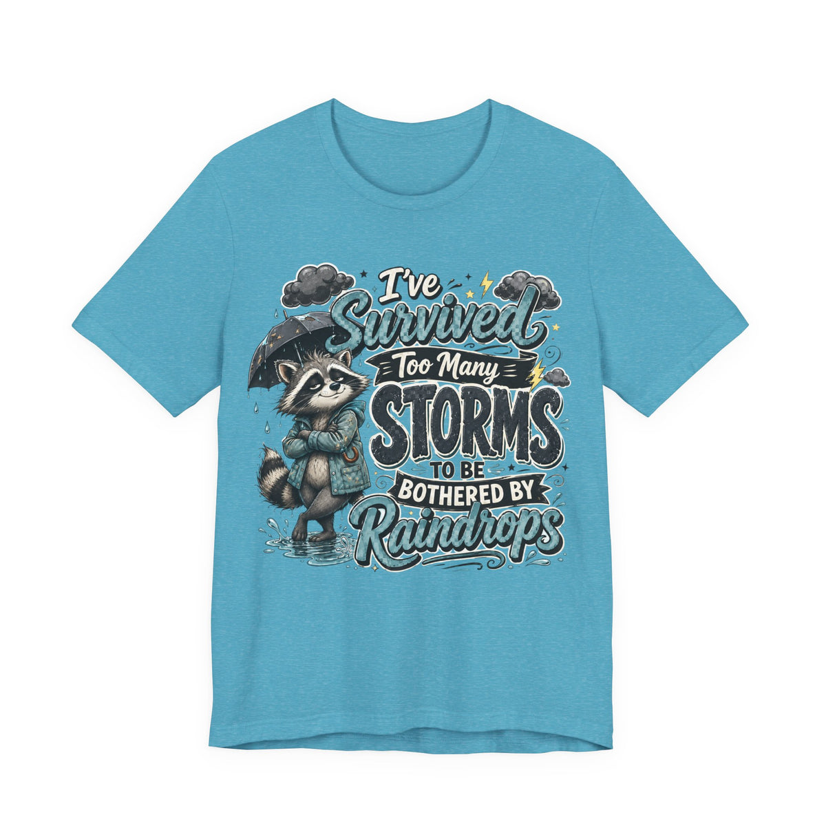 Survived Too Many Storms Tee — Inspirational Raccoon Rainy Day Graphic T-Shirt