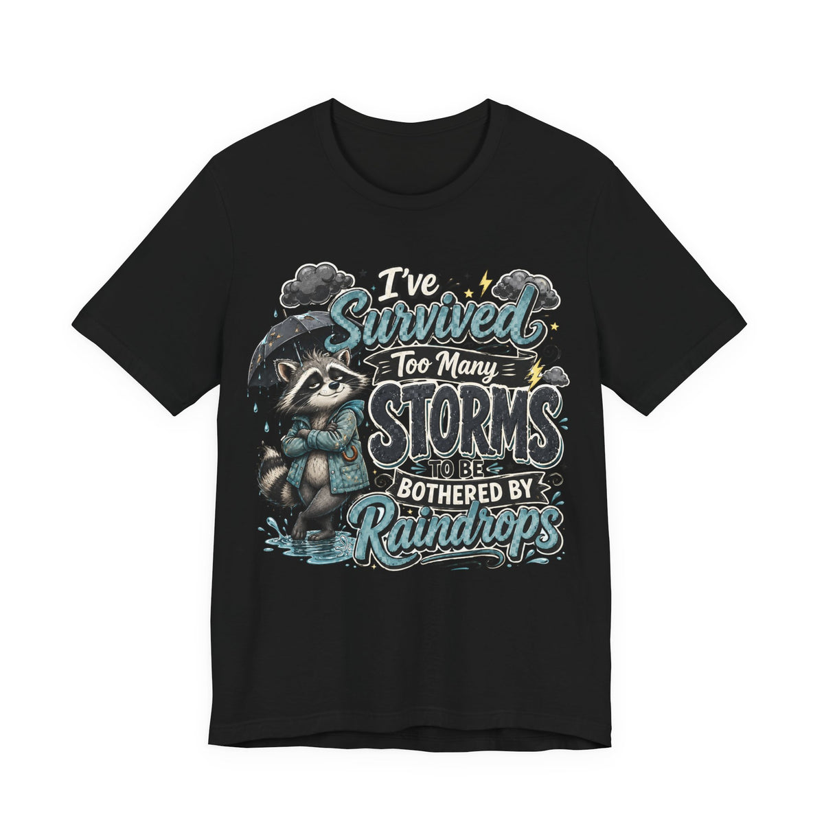 Survived Too Many Storms Tee — Inspirational Raccoon Rainy Day Graphic T-Shirt