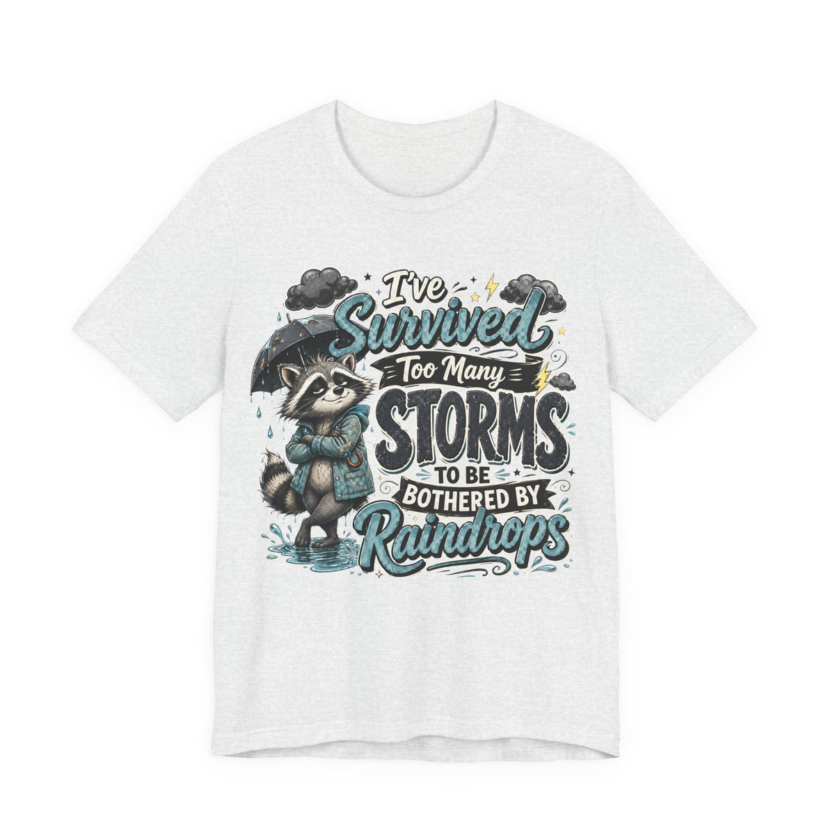 Survived Too Many Storms Tee — Inspirational Raccoon Rainy Day Graphic T-Shirt